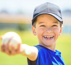 Kid holding baseball