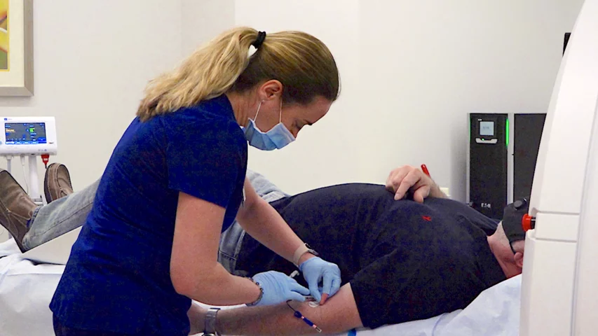 Placement of an IV line in a cardiac patient for CT contrast delivery during their scan. Duly Health and Care's outpatient, Cardiographe dedicated cardiac CT scanner in Lisle, Illinois.