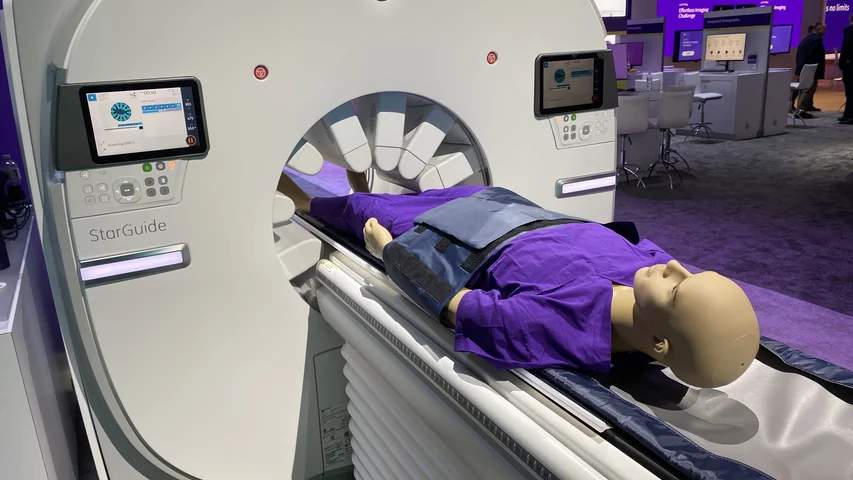 The GE Starguide SPECT-CT system uses arms containing the SPECT detectors that extent to the patient to enable clearer imaging. Photo by Dave Fornell. #RSNA #RSNA23 #RSNA2023