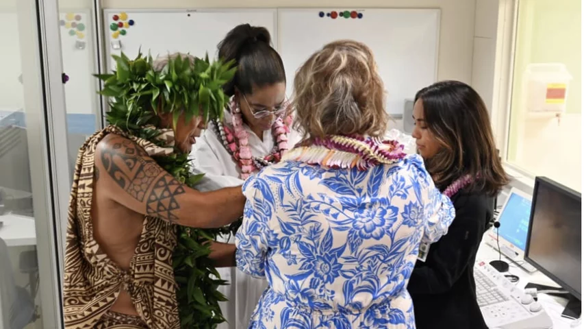 Oprah Winfrey participates in the blessing of the hands ceremony with the Maui Memorial imaging team.