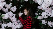 Child Sniffs Flower