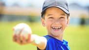 Kid holding baseball