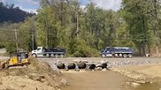 A temporary rock bridge provides access to the Baxter North Cove IV bag plant in North Carolina, which has enabled cleanup crews to begin work on the flooded plant that supplies 60% of U.S. IV bags. Photo from Baxter.