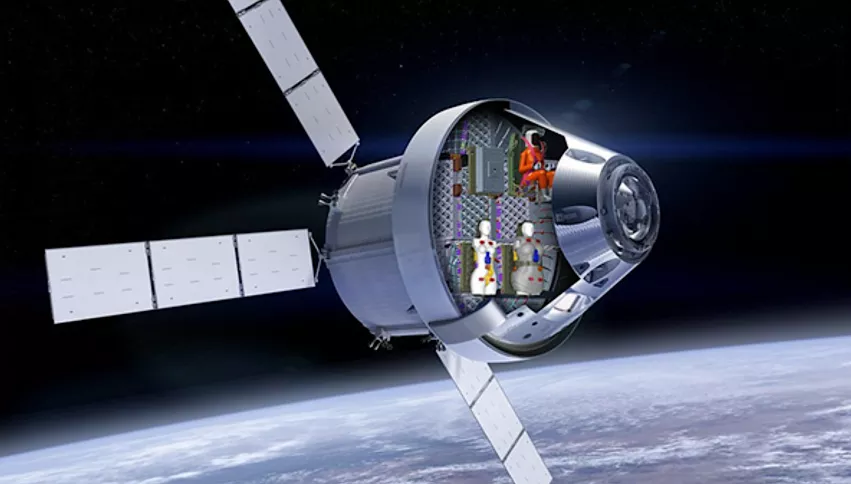Artists rendering of the Artemis I mission Orion space capsule with a cut away showing the two radiation detecting human phantoms. NASA/Lockheed Martin/DLR image