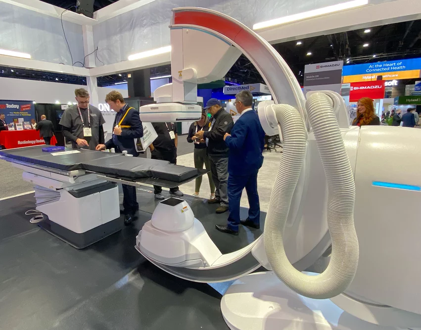 Shimadzu demonstrated a new voice-control system for its Trinias Opera angiography system at RSNA 2024. Without the need to push buttons, the hands-free system allows operators to control the C-arm position and overhead screen. Photo by Dave Fornell 