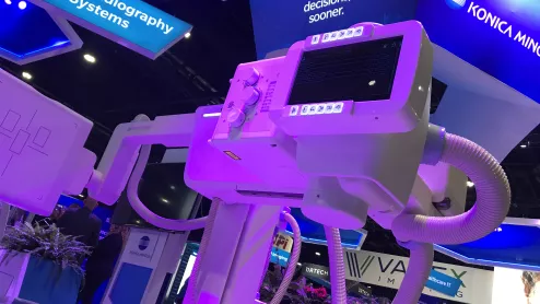 Fixed digital X-ray systems have seen increased market share after a dip in 2020 when hospitals used funding to but more mobile DR systems due to COVID. The Konica-Minolta booth DR system on display at RSNA 2022. Photo by Dave Fornell