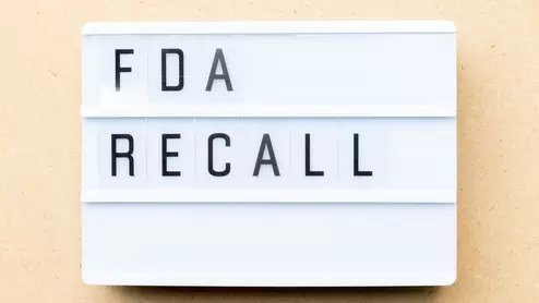 the words &quot;FDA recall&quot; on a board