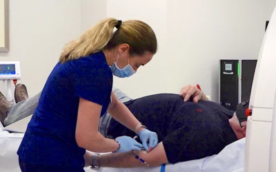 Placement of an IV line in a cardiac patient for CT contrast delivery during their scan. Duly Health and Care's outpatient, Cardiographe dedicated cardiac CT scanner in Lisle, Illinois.