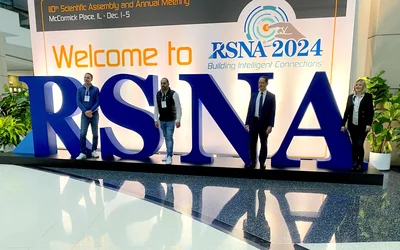 RSNA sign 2024 meeting, Attendees waited in a line, sometimes 50 or more deep, to get selfies or group shots like this with the large RSNA logo. #RSNA2024