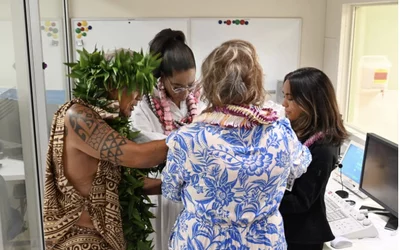 Oprah Winfrey participates in the blessing of the hands ceremony with the Maui Memorial imaging team.
