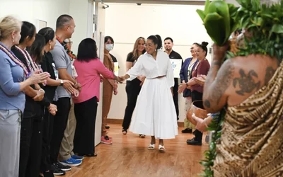Kahn Kimokeo begins blessing the new CT scanner with Oprah Winfrey at Maui Memorial Medical Center.
