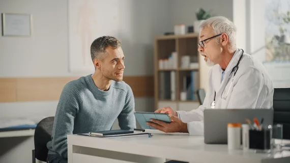 middle age patient and doctor middle age patient and doctor