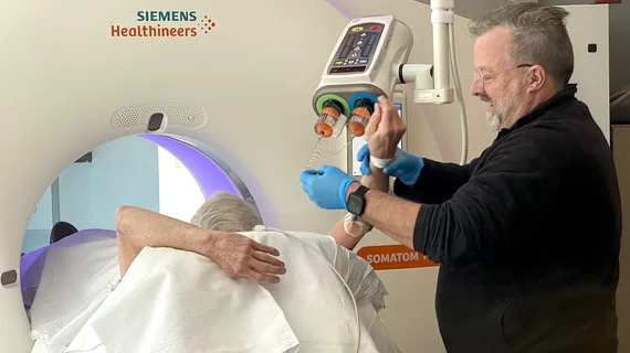 Technologist sets up a patient for a cardiac CT scan with IV iodine contrast contrast at Wellstar Kennestone Hospital in Marietta, Georgia. Photo by Dave Fornell