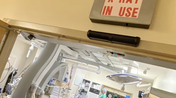 Cath Lab X-ray radiation warning sign above the door at Wellstar Kennestone Hospital. Photo by Dave Fornell